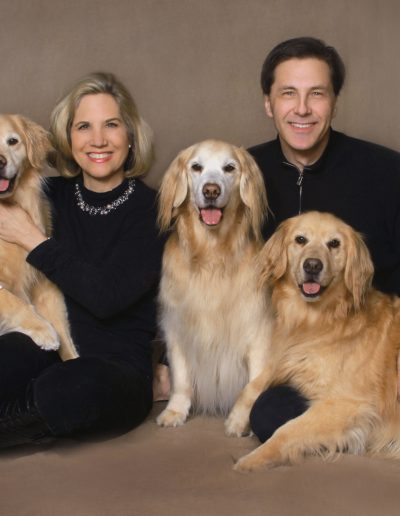 Family portrait with Golden Retrievers